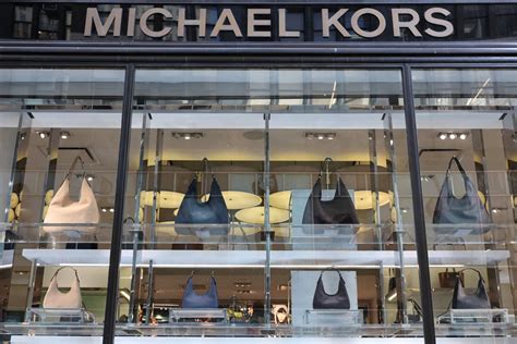 owner of michael kors|michael kors merger.